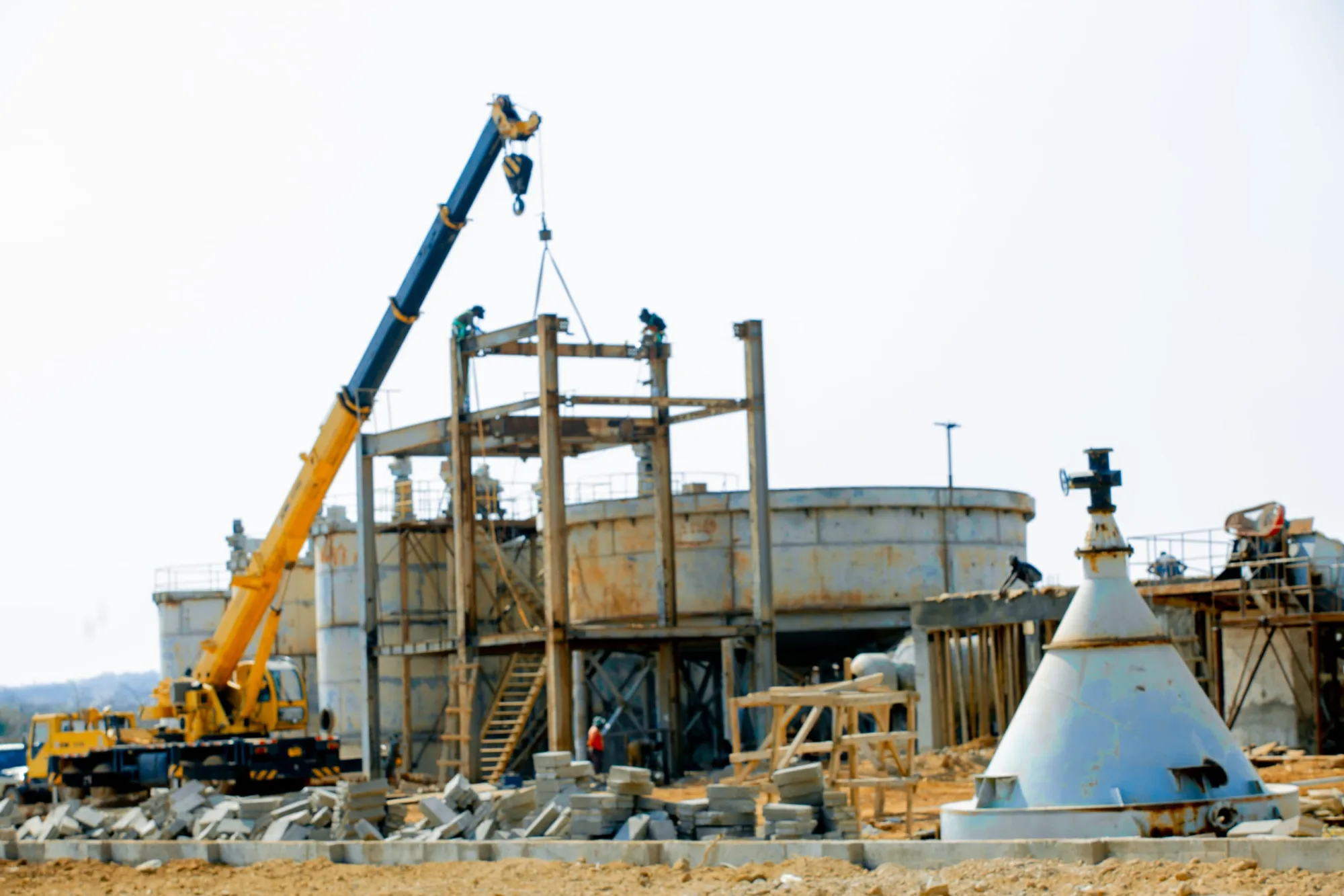 Mobile crane placing steelwork on the leach tank structure