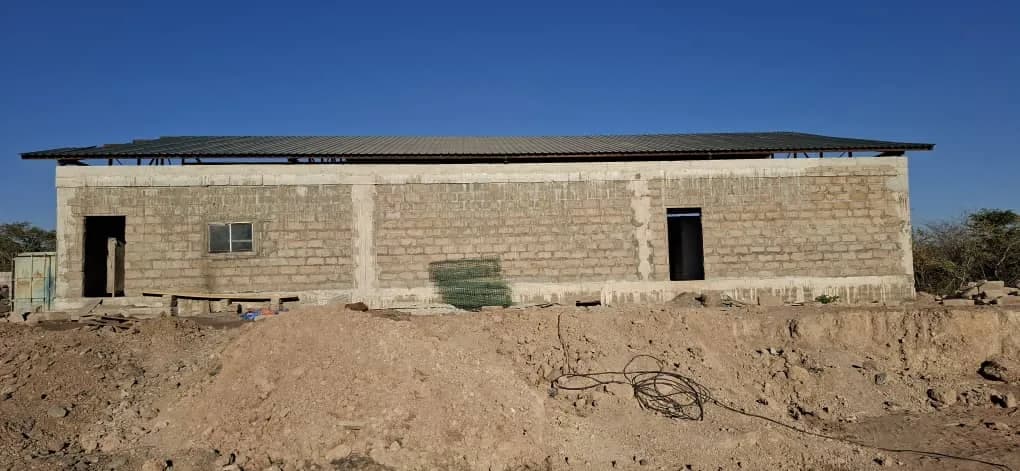 Completed workshop building with a corrugated roof