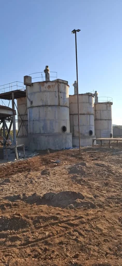 Three completed tanks with catwalks nearing completion