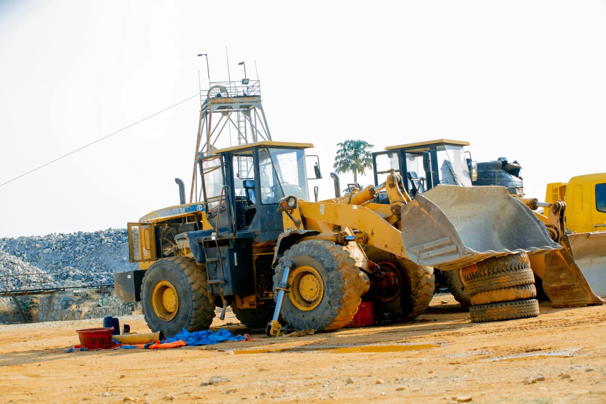 Wheel loaders parked beside the site watchtower