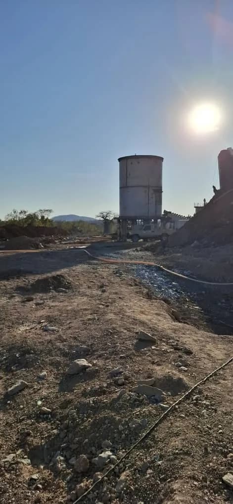 Elevated water tank at sunset