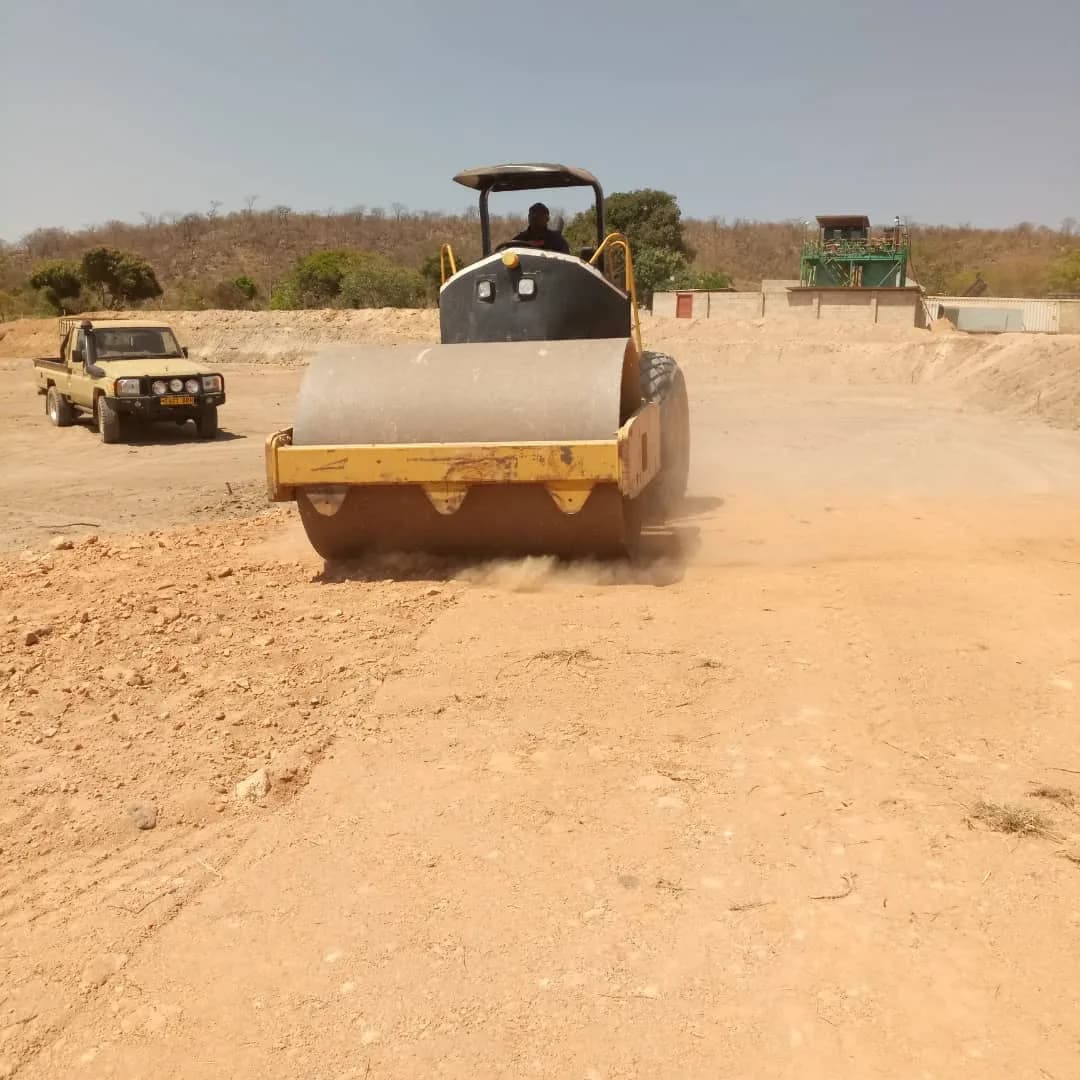 Roller compacting the red earth surface