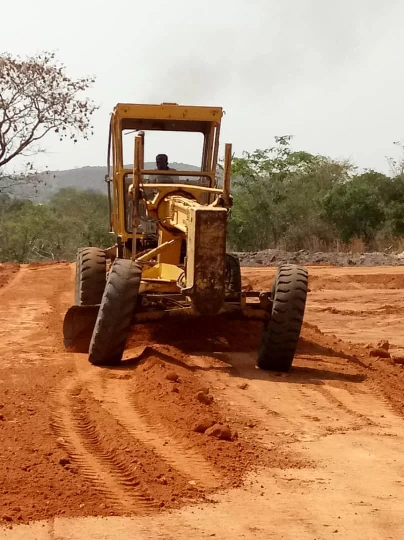 Roller compactor on the freshly graded pad
