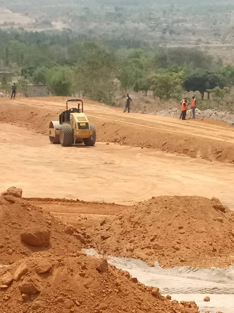Roller compacting the TSF pad overlooking the valley