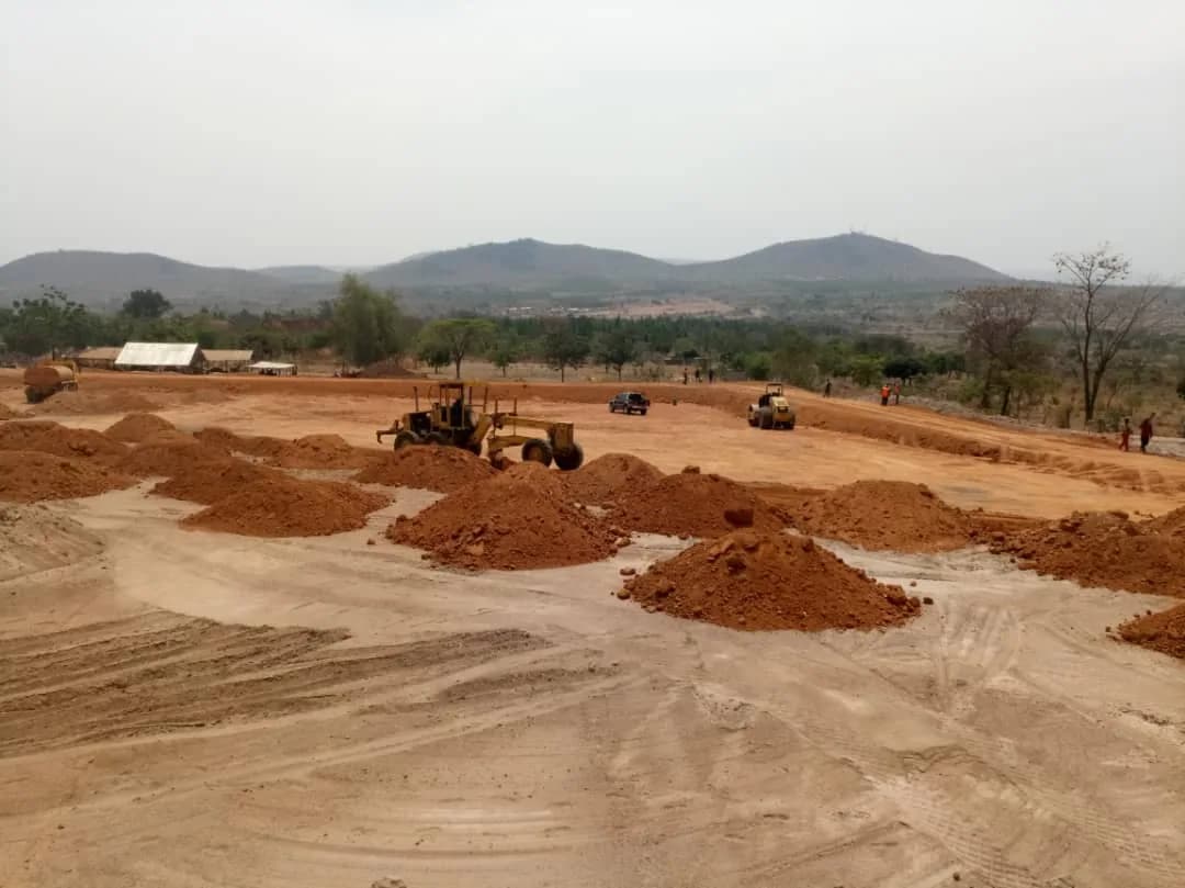 Elevated view of the graded TSF pad with the site camp beyond