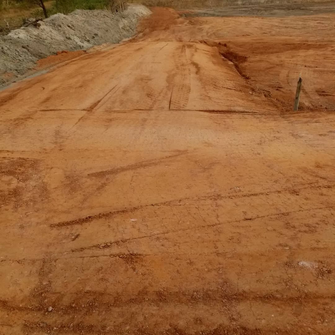 Close-up of the compacted red earth surface
