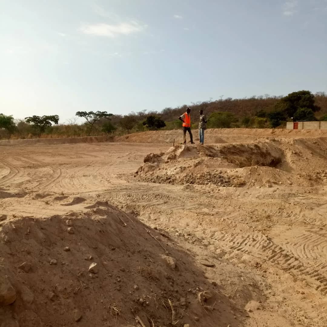 Workers surveying the excavated TSF basin