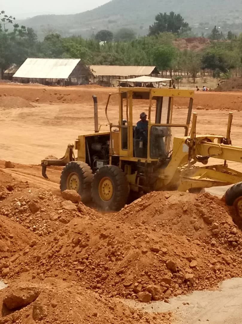 Grader working the access road near the site camp