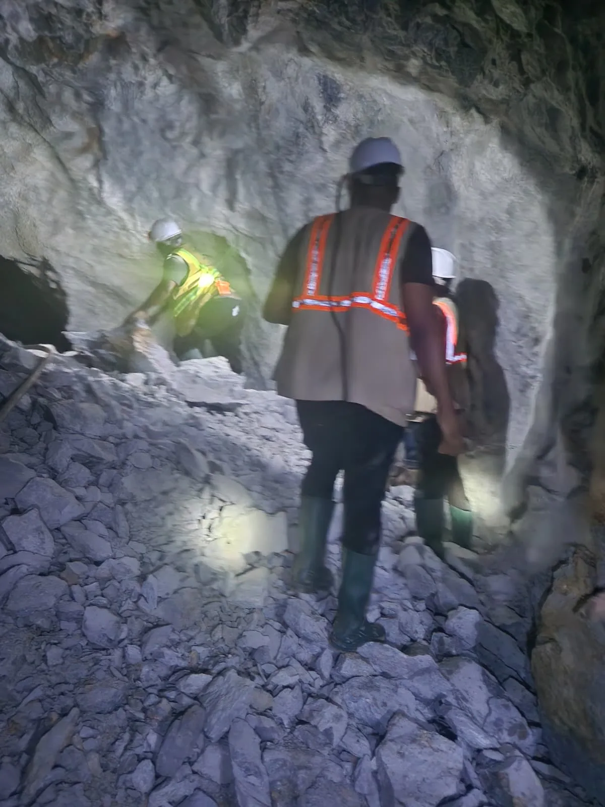 Geologists making their way through the underground workings