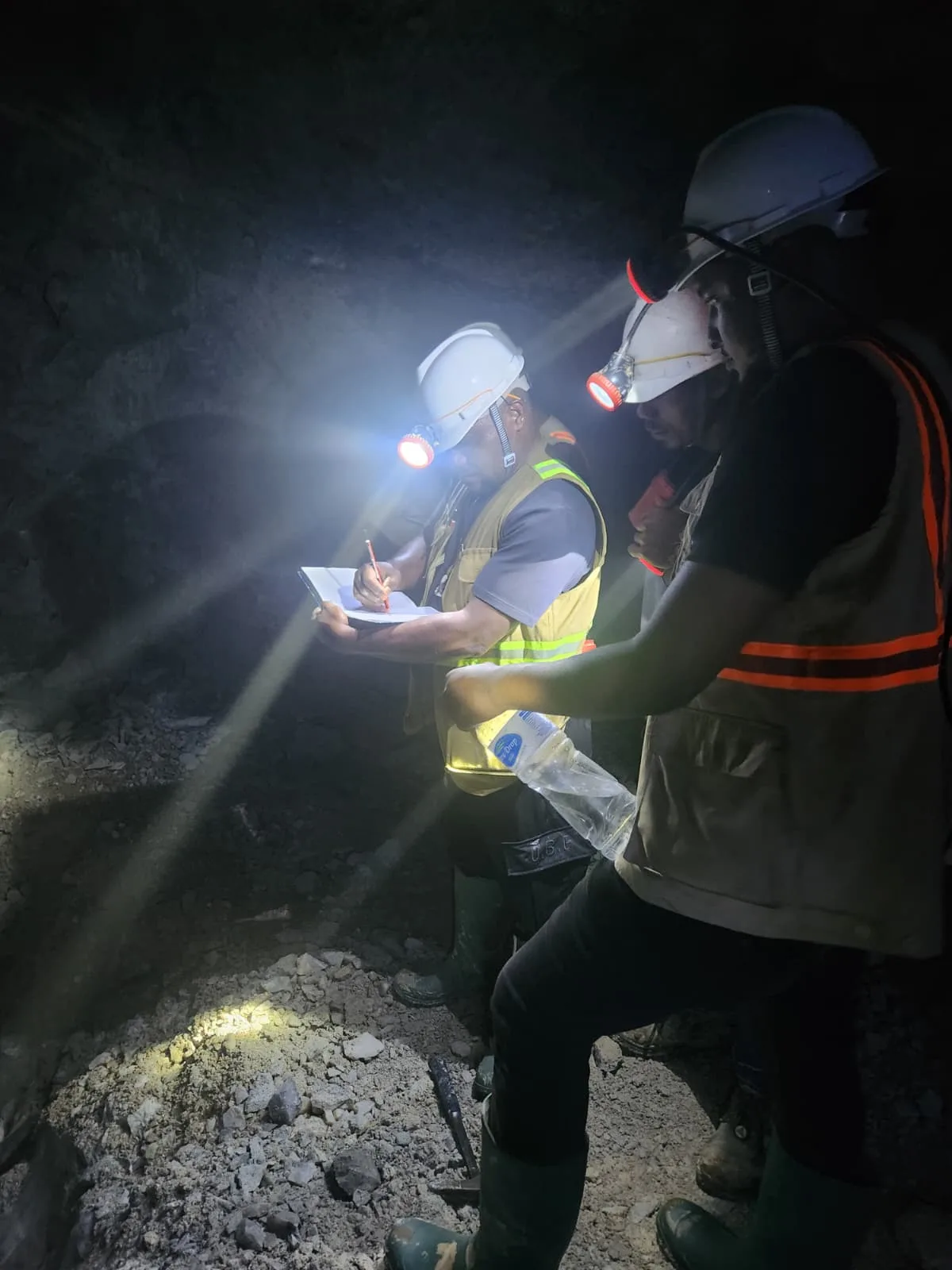Team conferring underground during the tunnel inspection