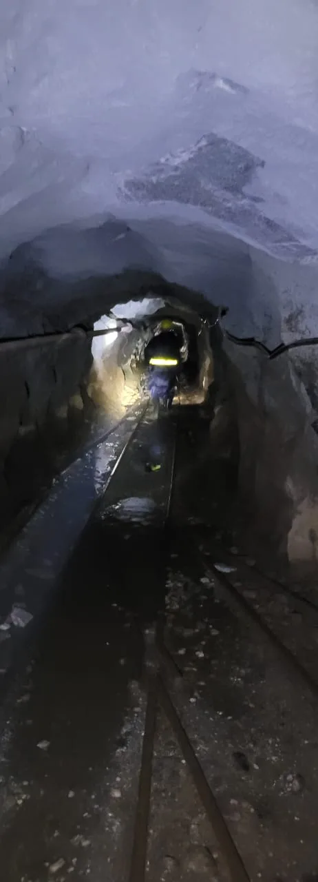 Miner walking the underground haulage tunnel