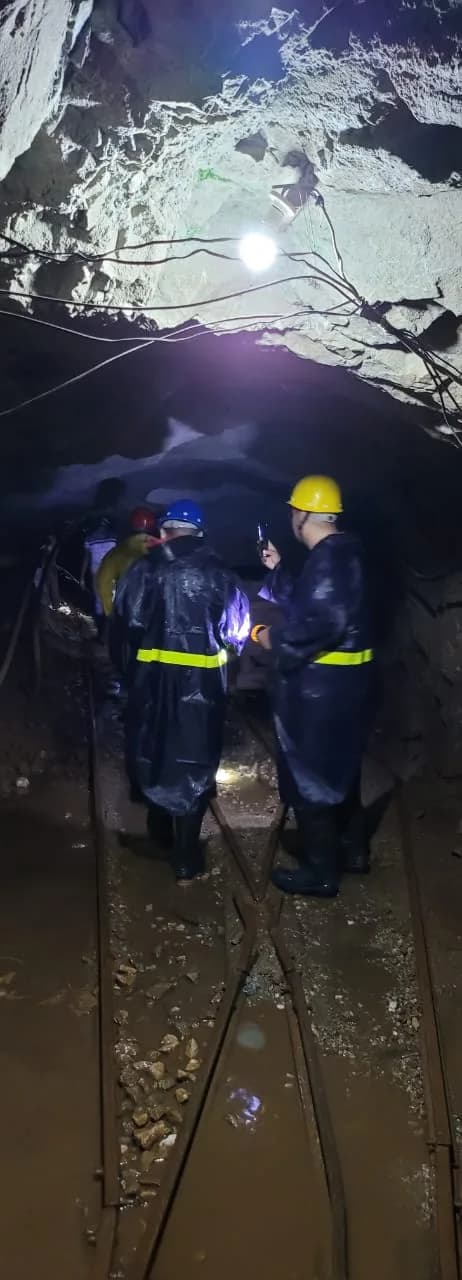 Miners at an underground rail junction
