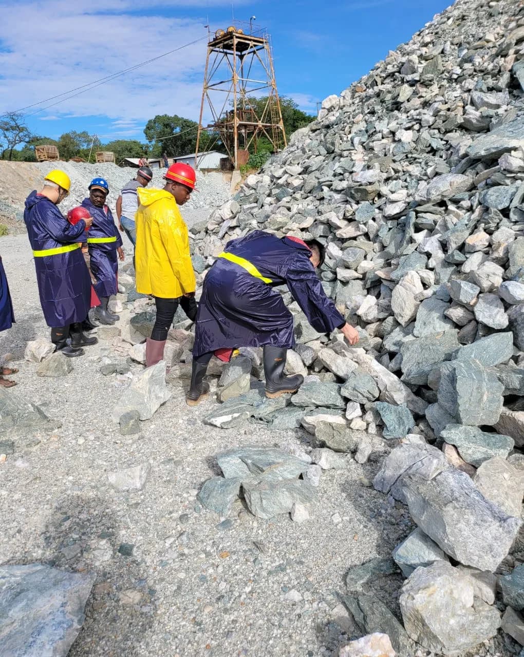 Team inspecting rock at the stockpile