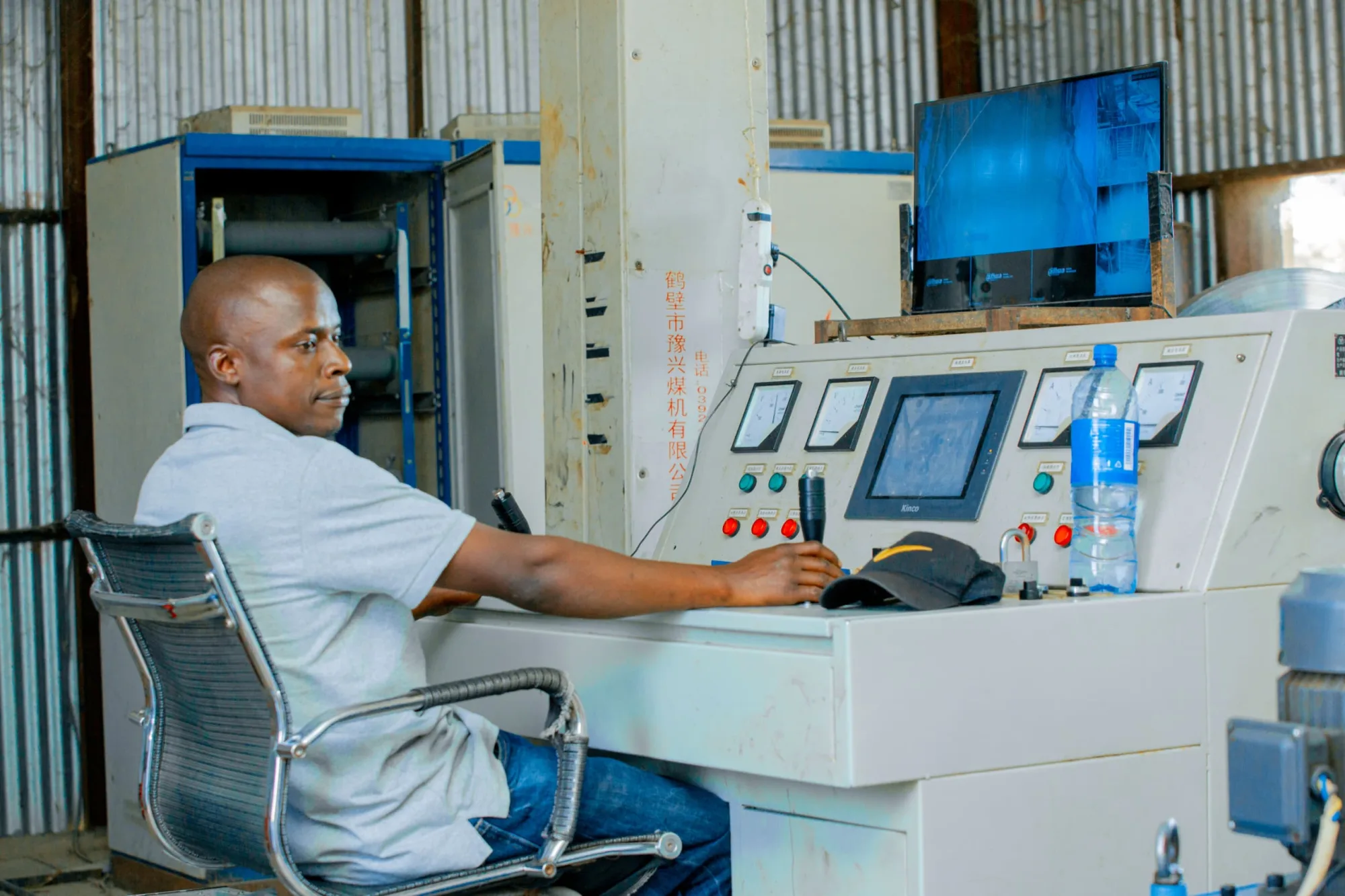 Operator adjusting the hoist controls
